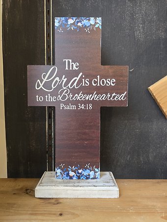 Cross with blue flowers, the Lord is close