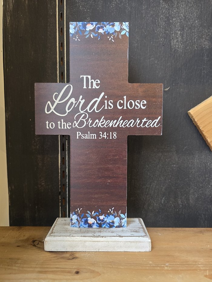 Cross with blue flowers, the Lord is close