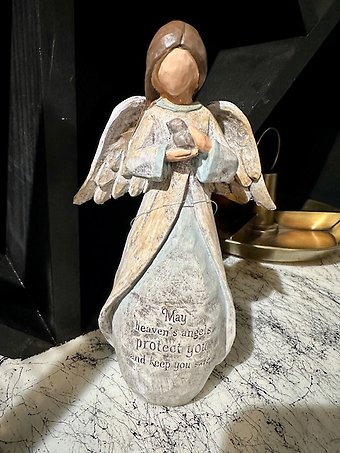 Angel holding a dove