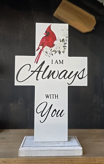 Cardinal cross \"love never dies\"